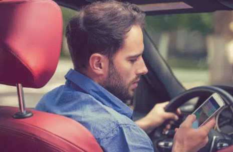 Man texting while driving
